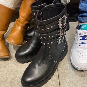 Black studded boot. Very trendy. New with Tags.